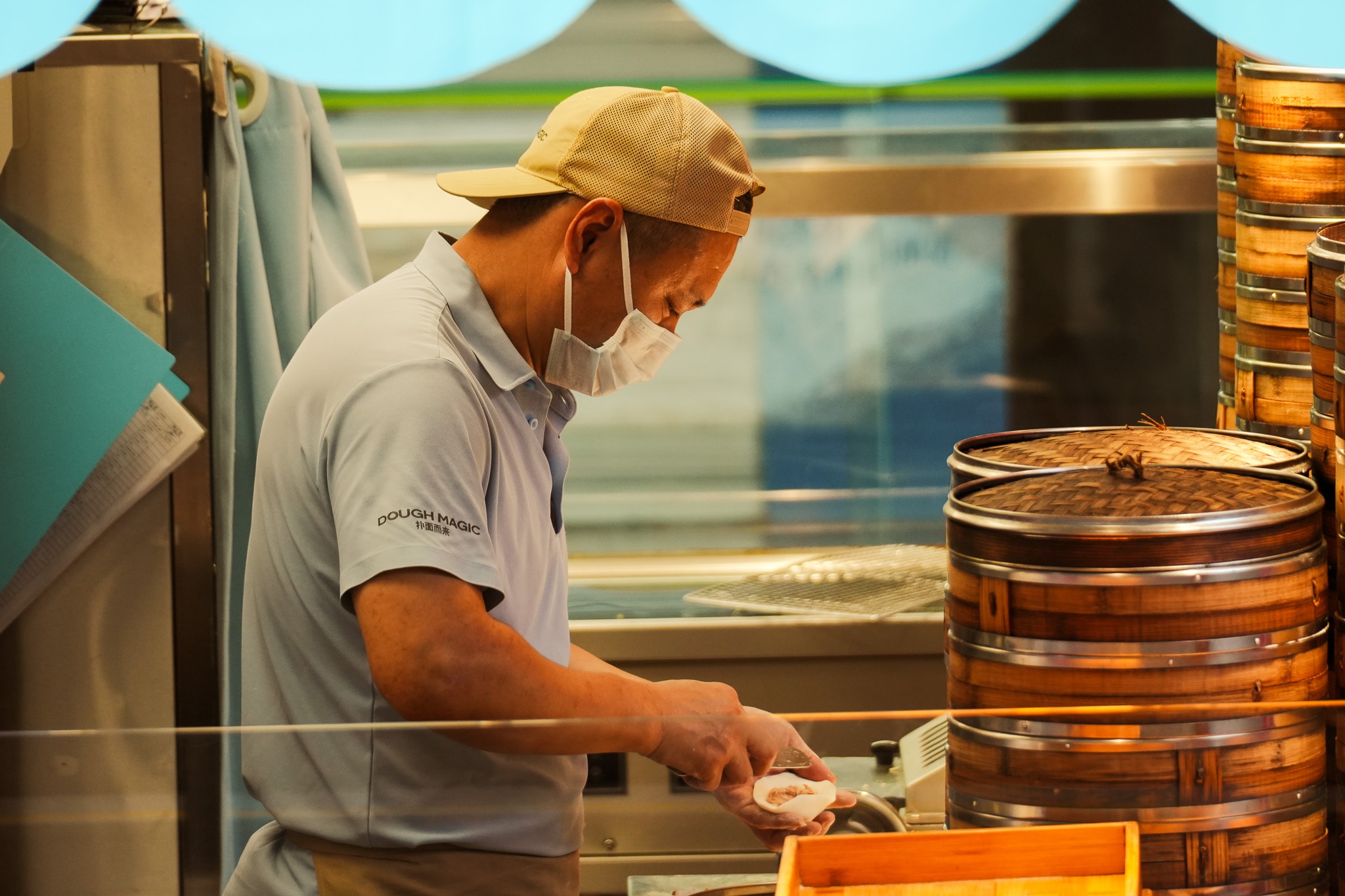 Baker preparing dough in commercial kitchen