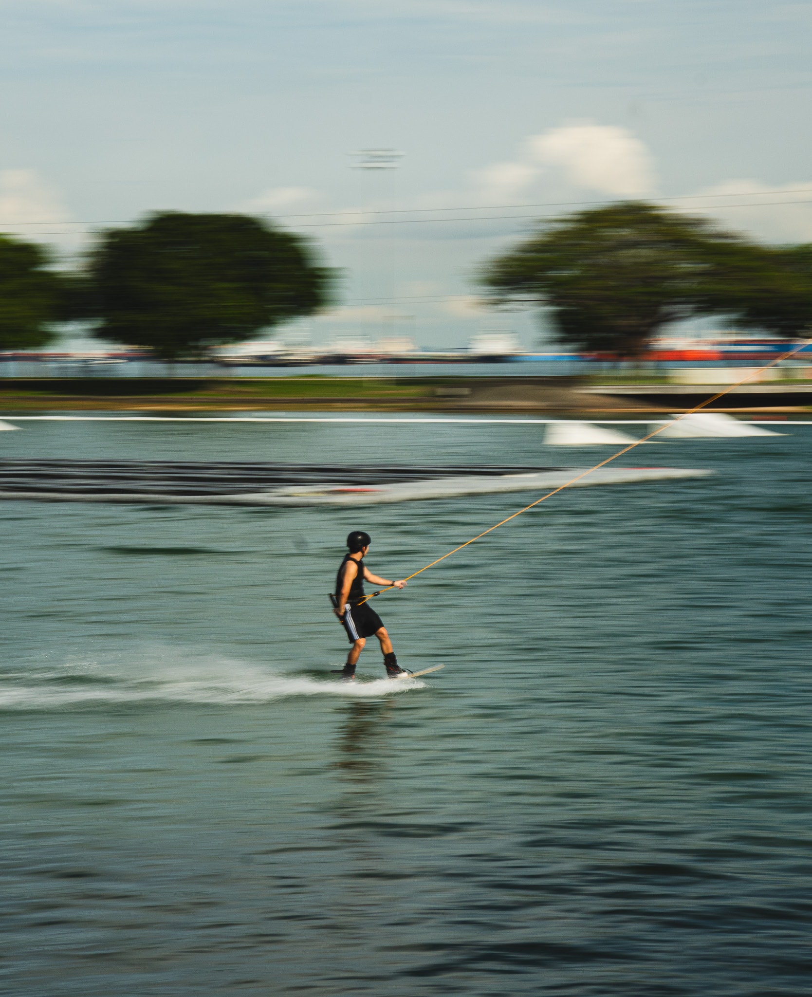 Person wakeboarding behind boat
