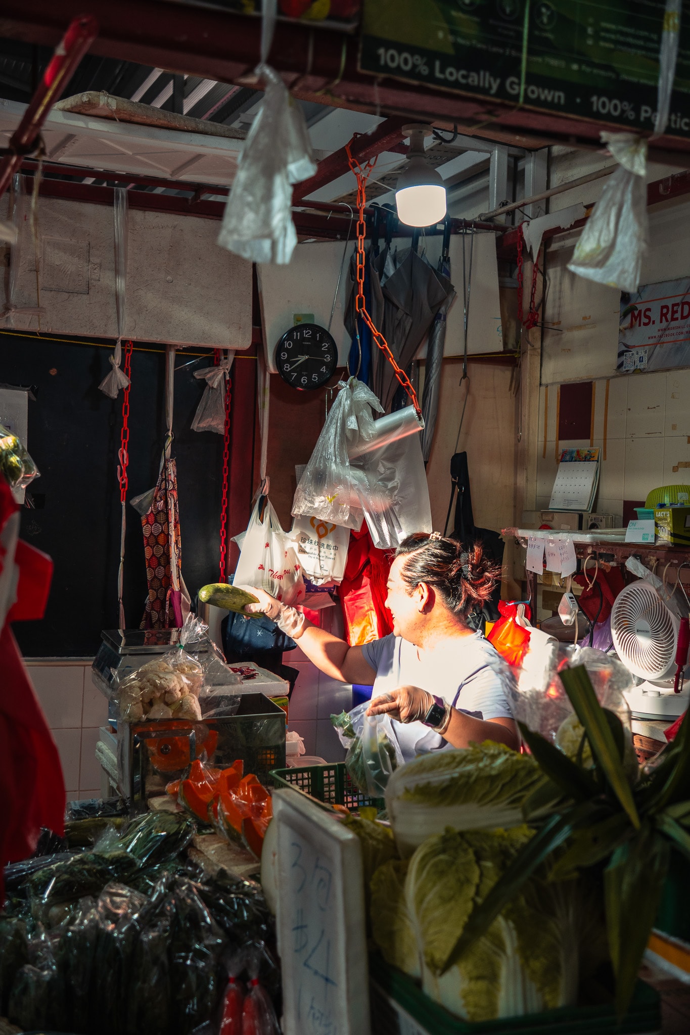 Vendor preparing food at market stall