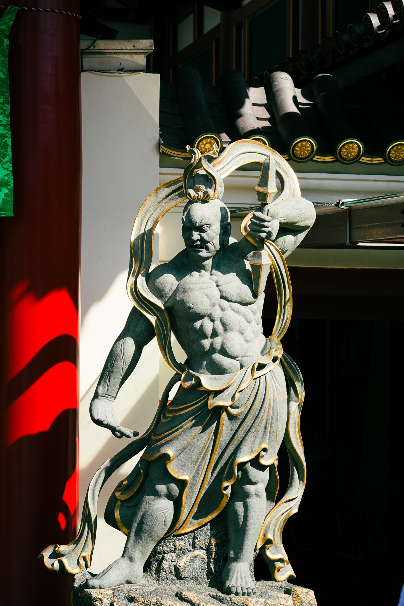 Ornate warrior statue holding sword